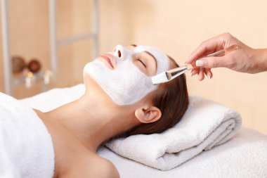 Attractive woman having mask in spa salon 