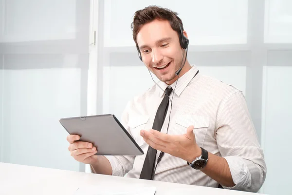 Call center operator holding laptop — Stock Photo, Image