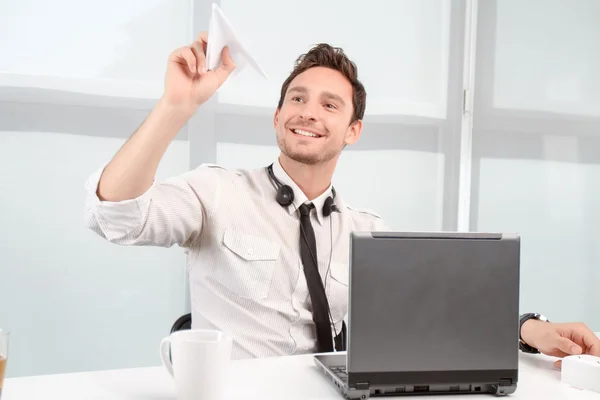 Positive call center operator holding paper plane — ストック写真