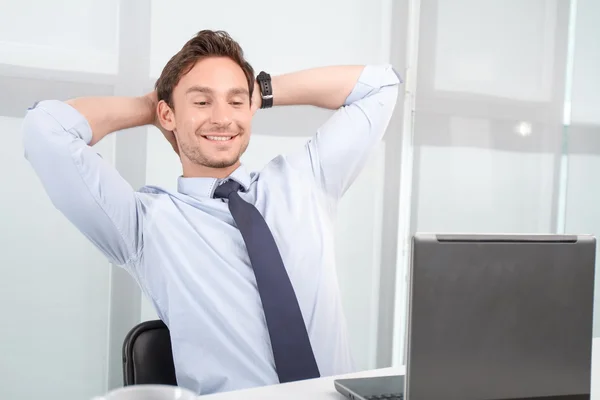 Lively call center operator holding hands on neck — ストック写真