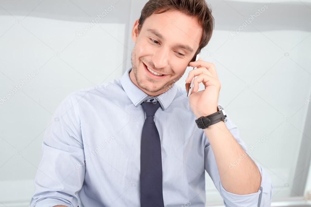 Call center operator talking on mobile phone 