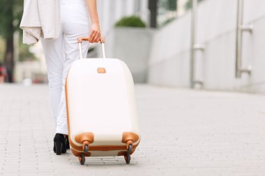 Nice woman doing with suitcase