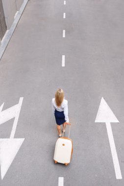 Attractive woman going along the road