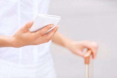 Stylish woman holding suitcase
