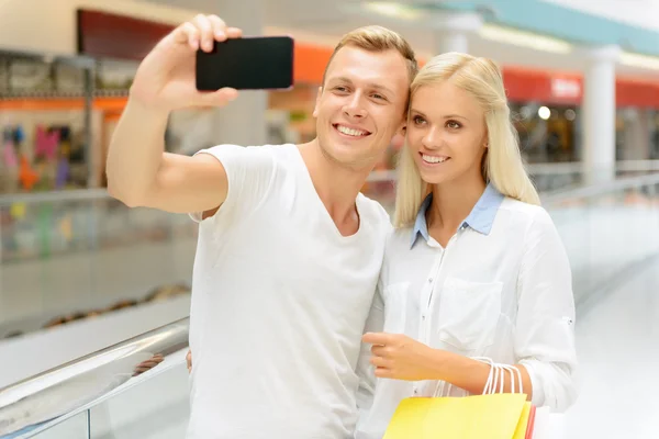 Handsome boy holding mobile phone — Stock Photo, Image