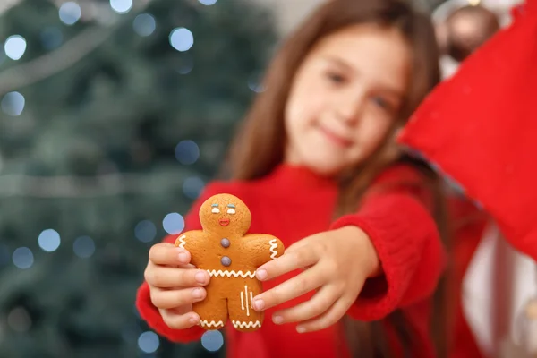 Nice girl holding ginger bread Stock Photo