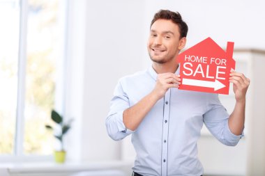 Pleasant realtor holding card clipart