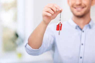 Nice realtor holding keys