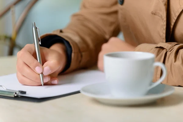 Pleasant girl writing — Stock Photo, Image