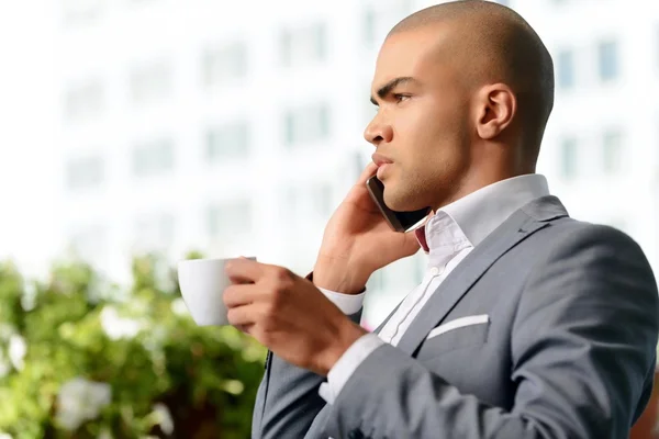 Pleasant businessman drinking coffee — Stock Photo, Image