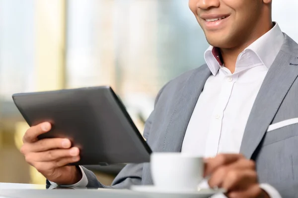 Real businessman holding laptop — Stock Photo, Image