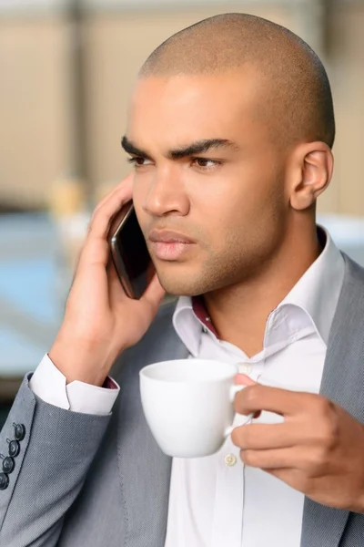 Pleasant businessman drinking coffee — Stock Photo, Image