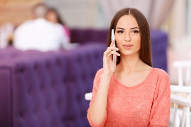Beautiful girl sitting in the cafe