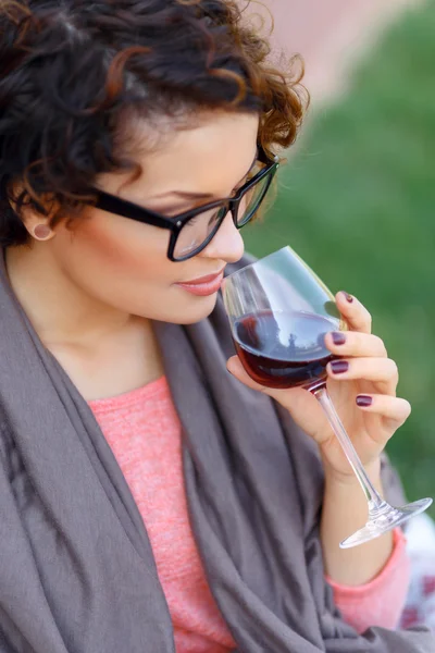 Pleasant girl drinking wine — Stockfoto