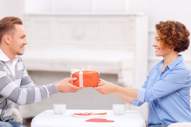 Pleasant man giving present