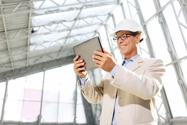 Pleasant architect holding laptop — Stok fotoğraf