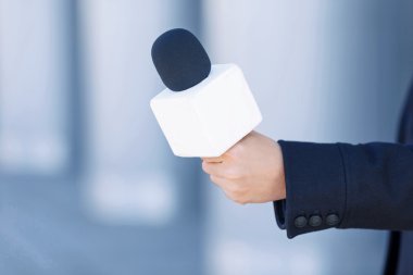 Close up of journalistic portable microphone. clipart