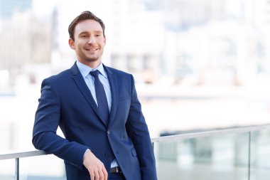 Young handsome man on the balcony.