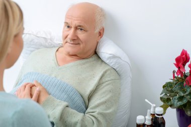 Young relative takes care of her sick grandfather.