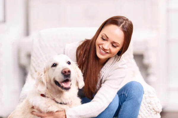 Young girl patting her pet dog. — Stock Photo, Image