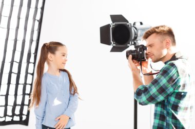 Little girl enjoys her time during photoshooting.