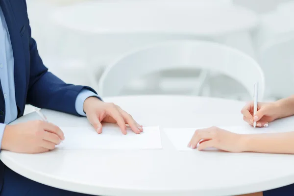 Two colleagues making personal notes. — Stock Photo, Image