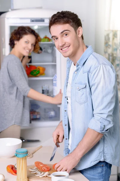 Loving couple cooking together — Stock Photo, Image