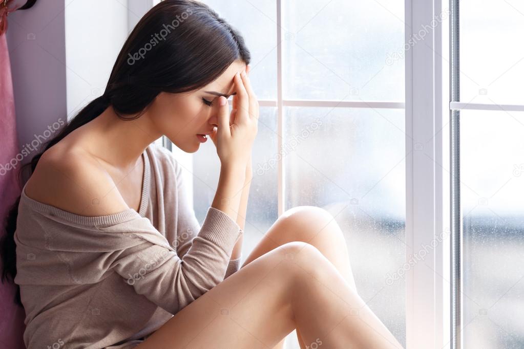 Young woman feeling headache