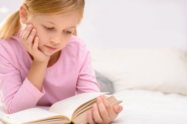 Pretty little girl reading