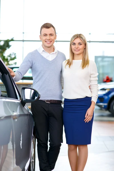 Happy couple going to buy a car — Stock Photo, Image