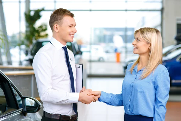 Sale assistants  shaking their hands — Stock Photo, Image