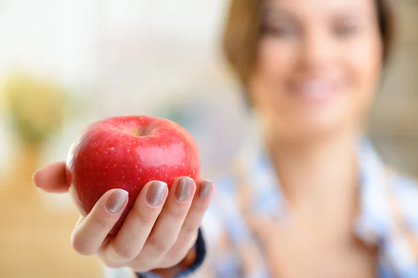 Red apple in girls hand. — Stock Photo, Image