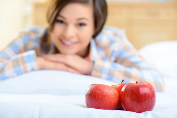 Close up of tree apples and a girl. — Stock Photo, Image