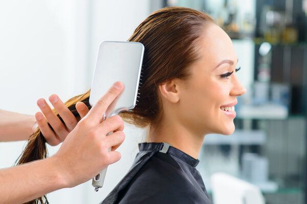 Clients hair being thoroughly brushed.