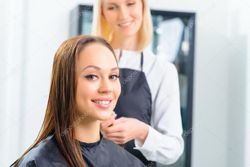 Customer and her stylist in the salon.