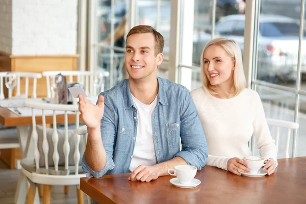 Delighted couple resting in the cafe — Stock Photo, Image