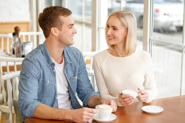 Loving couple sitting in the cafe Stock Image