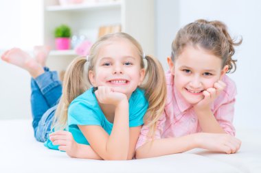Pretty sisters having fun at home