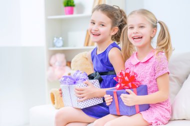Pleasant sister celebrating at home