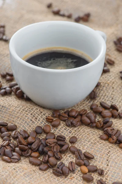 Cup of coffee standing on the table — Stock Photo, Image