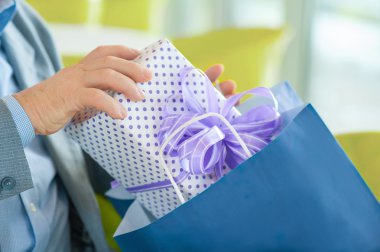 Close-up shot of box with present.