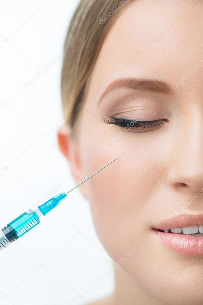 Professional cosmetologist making beauty injections