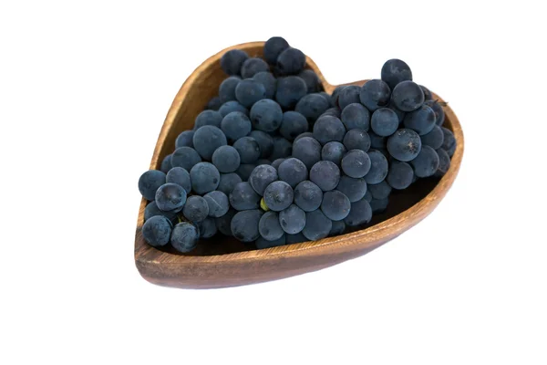 Uvas en forma de corazón plato de madera — Foto de Stock