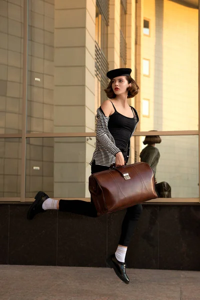 Beautiful Young Woman Big Retro Travel Bag Jumps Front Building — Stock Photo, Image