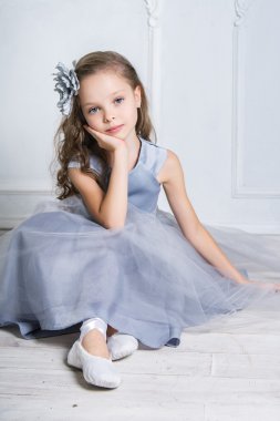 Beautiful girl in gray dress