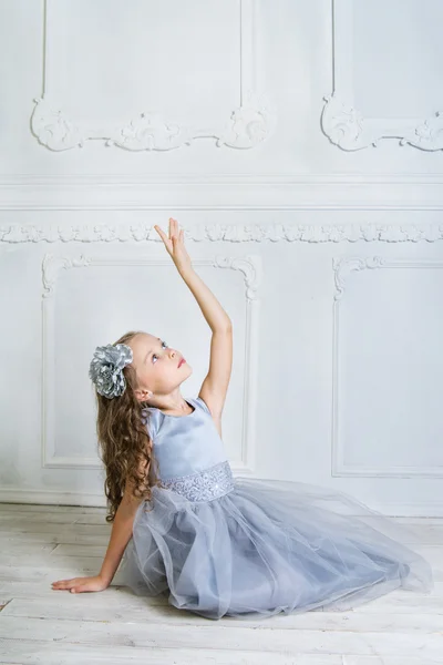 Beautiful girl in gray dress — Stok fotoğraf