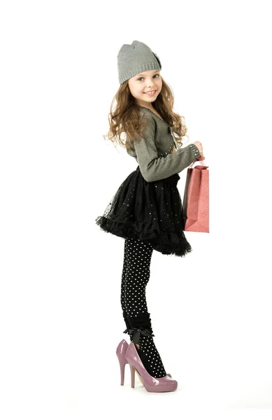 Fashionable little girl in her mother's shoes — Stock Photo, Image