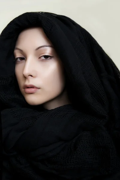 Girl with perfect skin in a black scarf — Stock Photo, Image