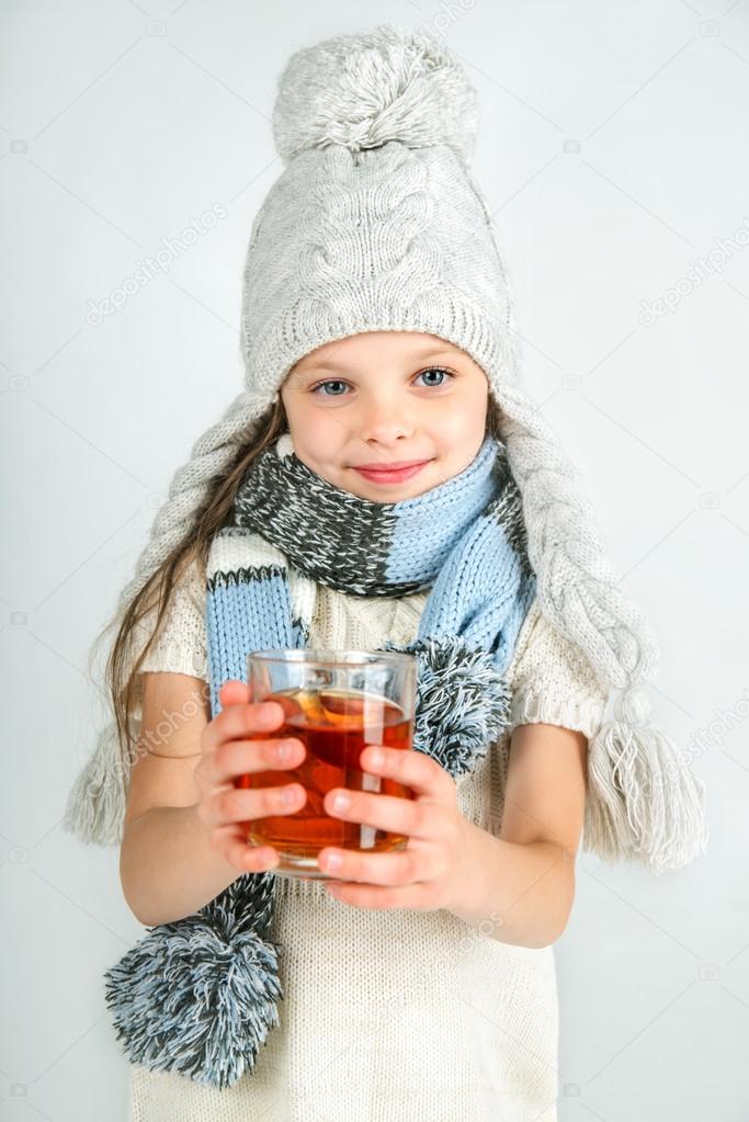 Beautiful Happy Smiling Winter Girl with Tea Mug.