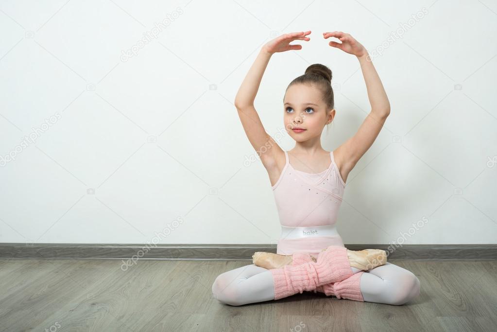 young ballerina does ballet poses